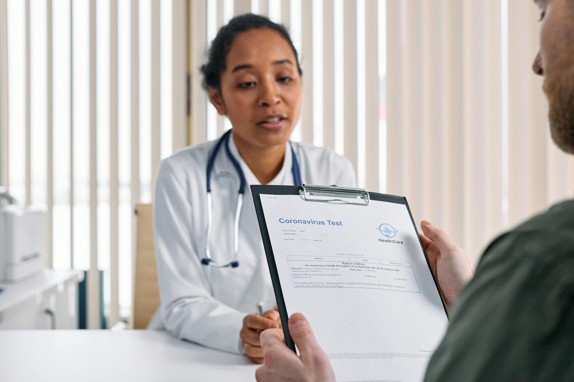 caucasian-doctor-consulting-patient-working-cabinet caucasian-doctor-consulting-patient-working-cabinet